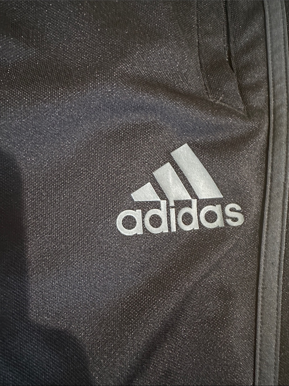 Womens Adidas Black Joggers with Gray stripes zippers on outsides of legs. Med